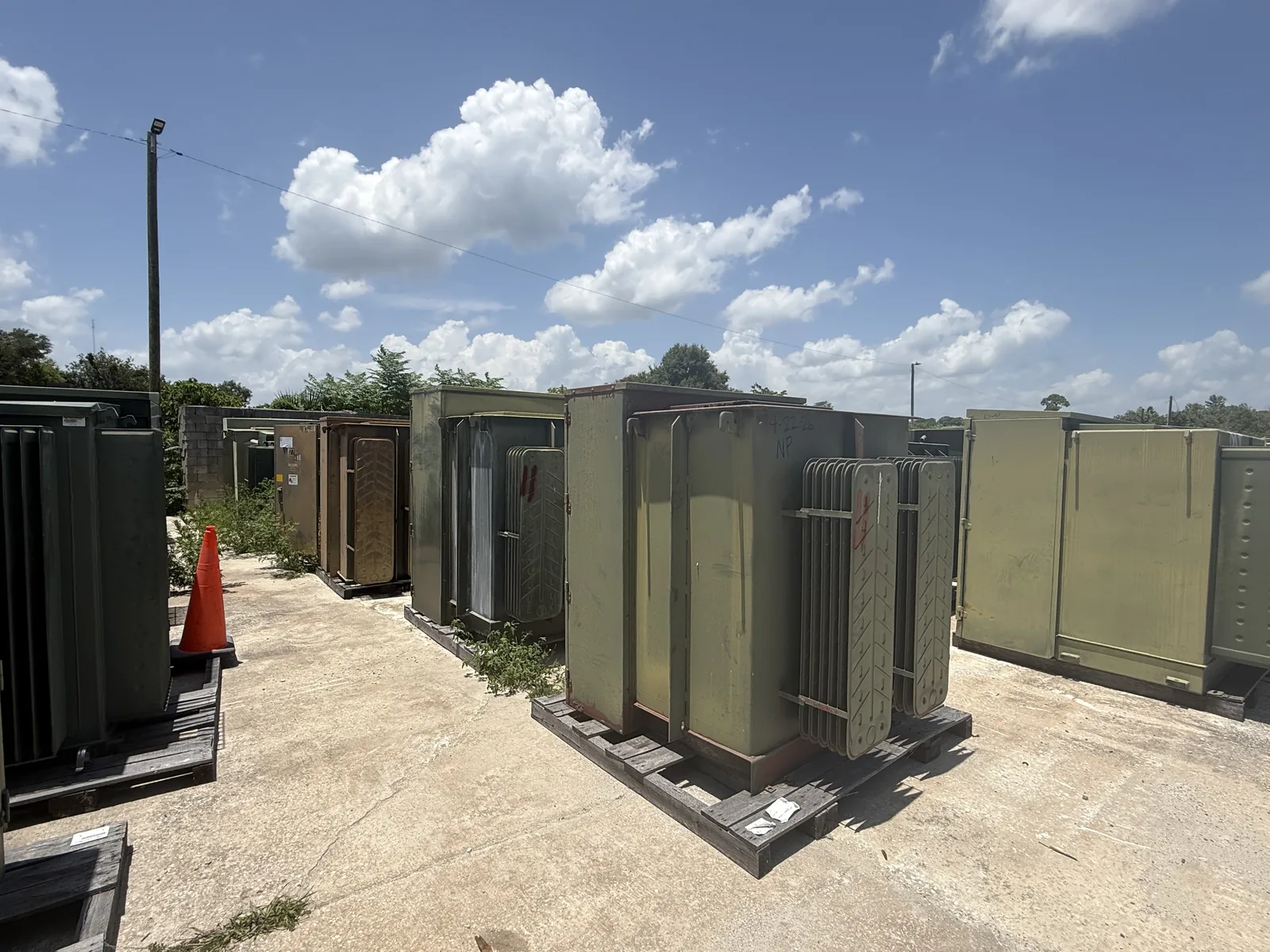 Power Demolition — transformer yard with rows of padmount transformers